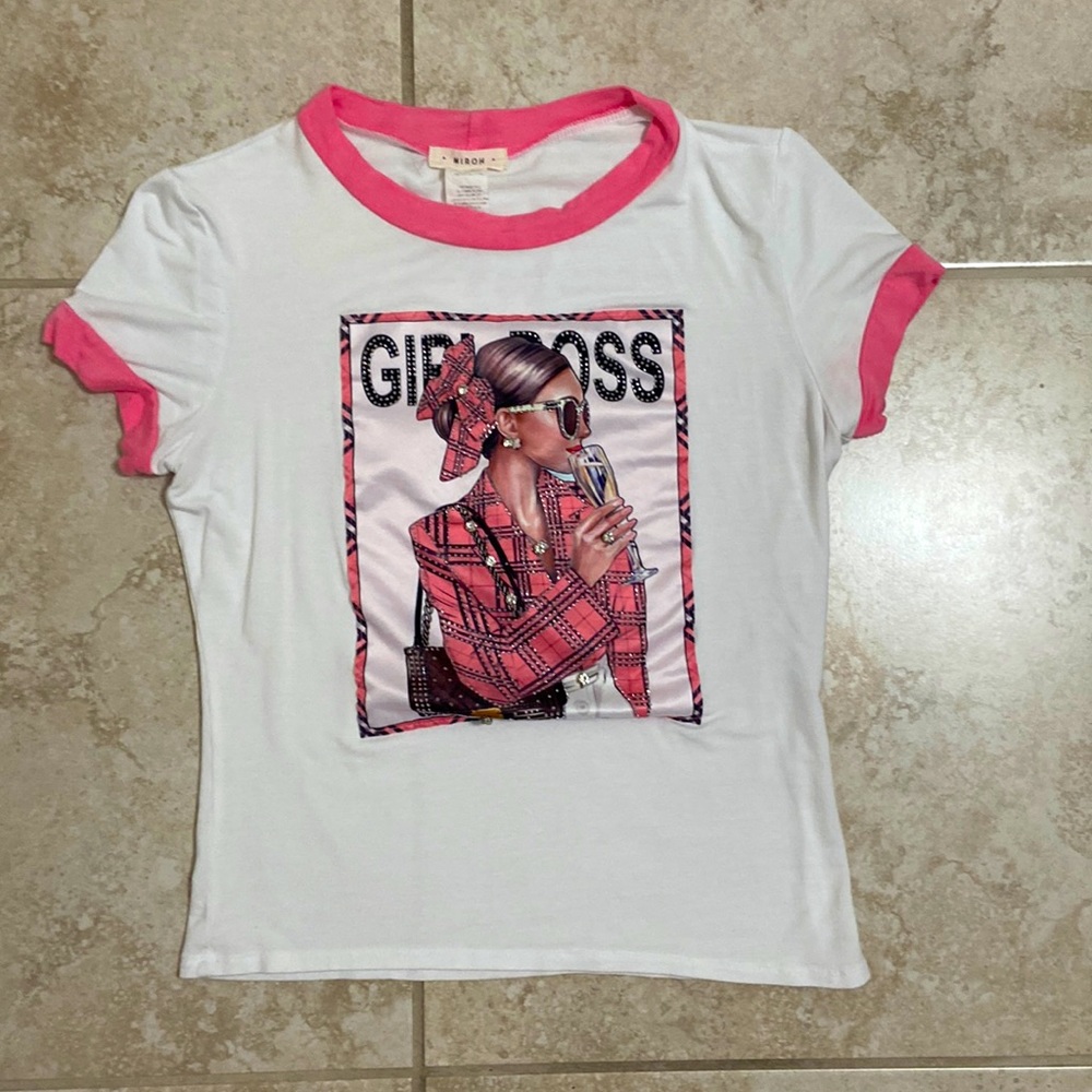 White top with pink outlines and an image of a women. Says “girl boss”.